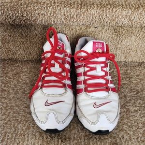 Nike White and Red Sneakers with Iconic Swoosh